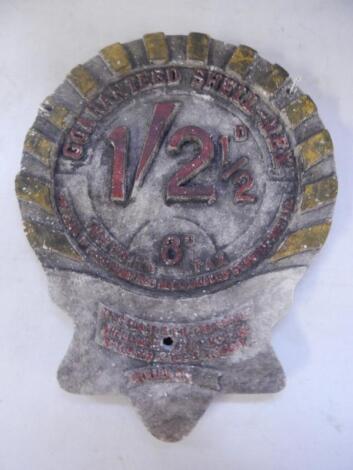 A Shellmex 1 shilling 2 1/2d wall mounted pump head price badge.