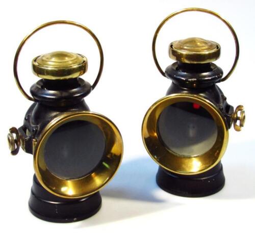 A near matching pair of coach lanterns