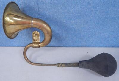 A brass S shaped car horn