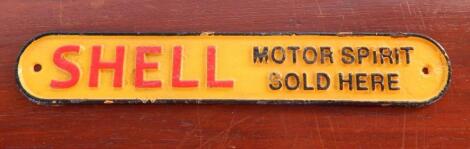 A cast iron Shell Motor Spirit Sold Here plaque