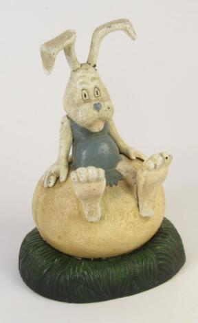 A cast iron comic rabbit money box