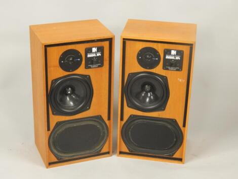 A pair of KEF acoustic speakers