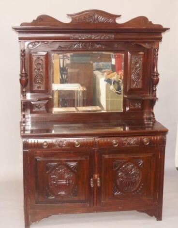 A late 19thC carved walnut sideboard