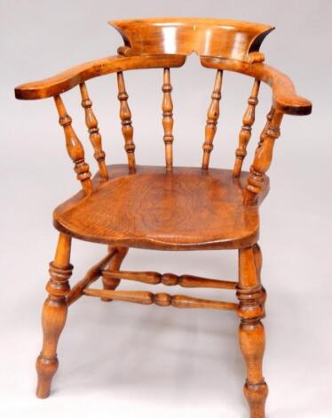 A Victorian oak and elm smoker's bow chair