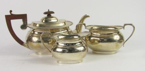 A George V silver three piece tea set