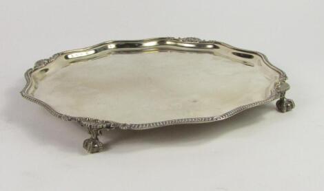 A silver piecrust salver