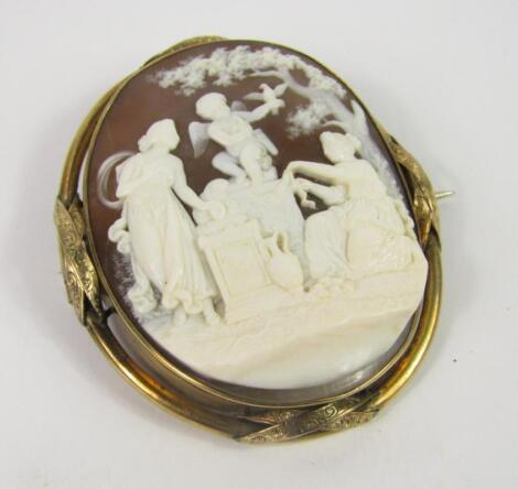 A yellow metal and shell cameo brooch