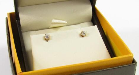 A pair of 9ct gold and diamond ear studs