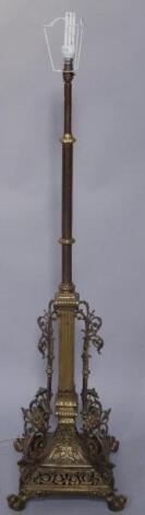 An early 20thC brass adjustable standard lamp