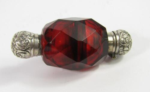 A Victorian cranberry glass double ended scent and smelling salts bottle