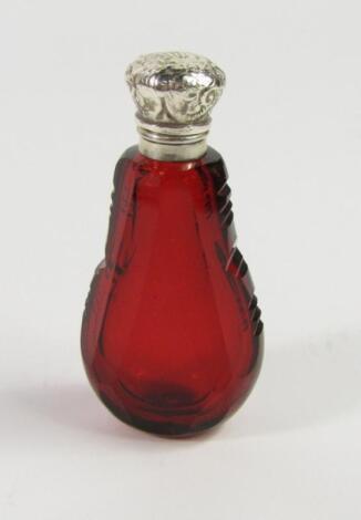 A Victorian cranberry glass scent bottle