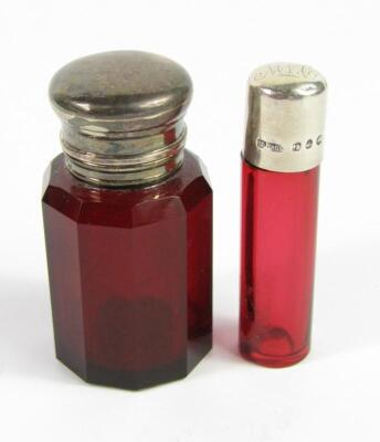 A Victorian faceted cranberry glass smelling salts jar