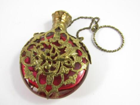 A Victorian cranberry glass scent bottle