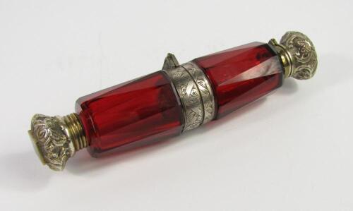 A Victorian cranberry faceted glass scent and smelling salts bottle