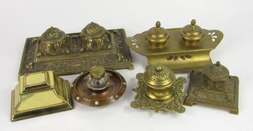 Five Victorian and later brass single or twin inkwells