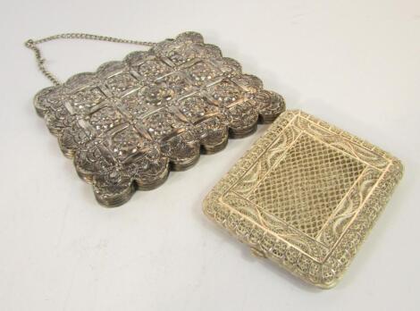 An Indian white metal filigree cigarette case