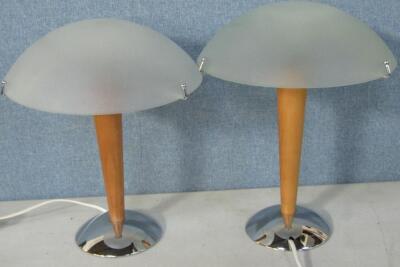 A pair of IKEA wooden and metal table lamps