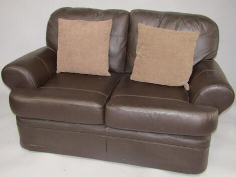 A leather two seater sofa