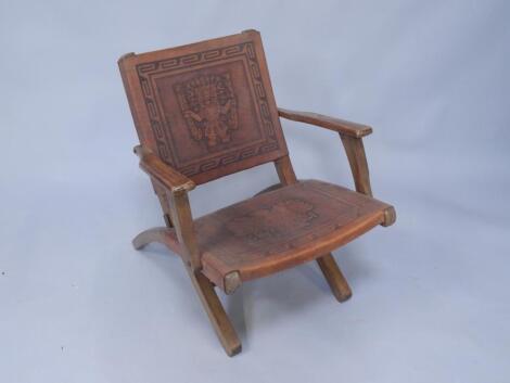 A hardwood folding armchair