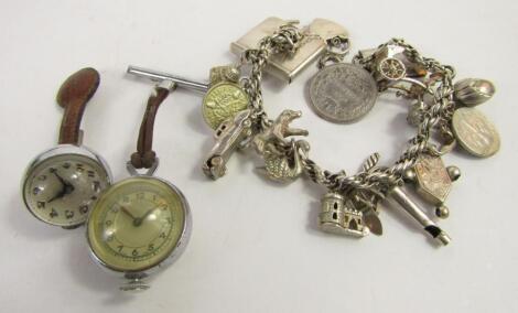 A silver charm bracelet with nineteen charms