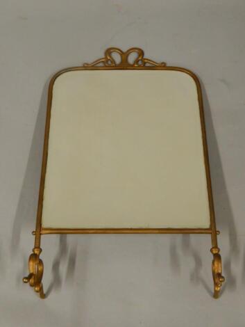 A gold spray printed Art Nouveau cast metal fire screen inset bevelled glass