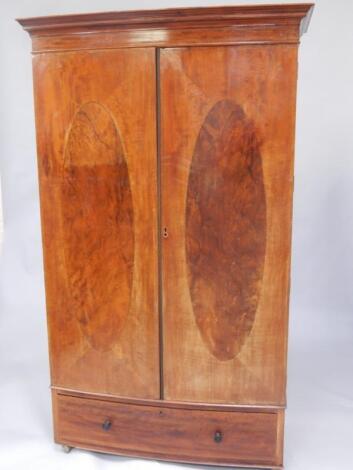 An Edwardian mahogany and line inlaid bow front wardrobe