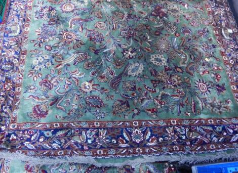 A Shiraz green ground rug