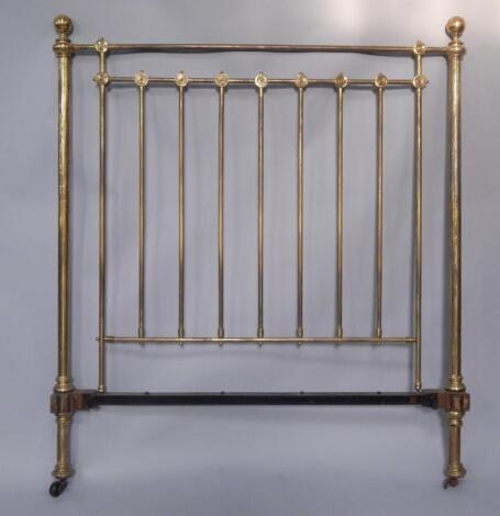 A pair of Edwardian Heal & Son brass and cast iron single beds