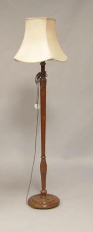 An early 20thC mahogany standard lamp