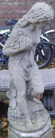 A stone garden statue modelled as Andromeda chained to the rocks