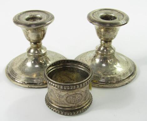 A pair of George V silver dwarf candlesticks