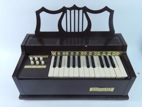 A Rosedale electric chord organ