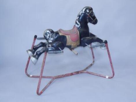 An English tinplate rocking horse