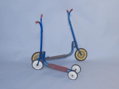 A Tri-ang red and blue three wheeled scooter