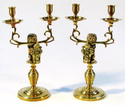 A brass candlestick garniture