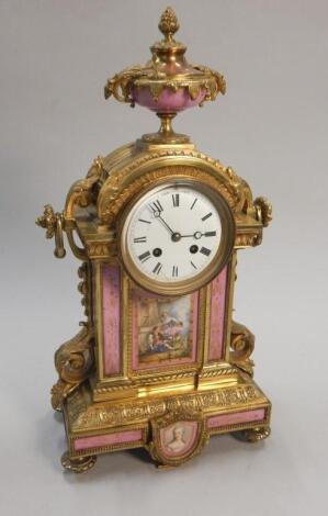 A 19thC French gilt metal and porcelain mounted mantel clock