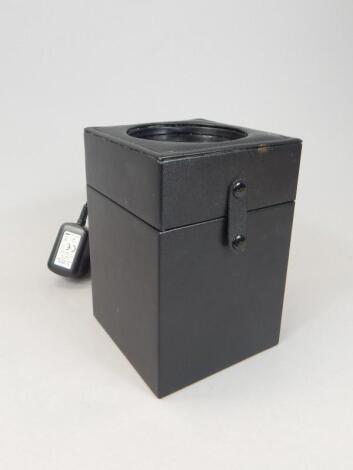 An unbranded leatherette watch winder