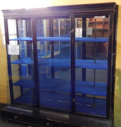 *An early 20thC ebonised shop display cabinet