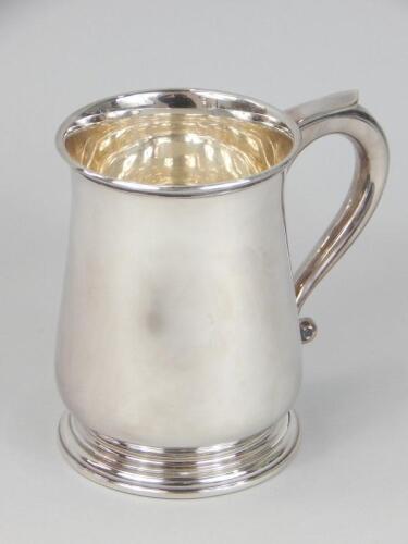 A modern silver baluster shaped mug