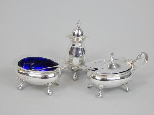 A modern silver three piece cruet