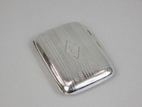 A silver Art Deco period engine turned cigarette case