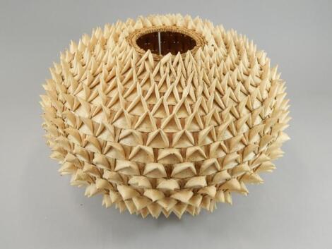 A Retro style woven raffia porcupine lamp shade