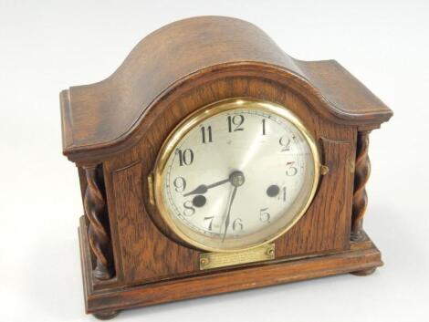 A 1920's oak mantel clock