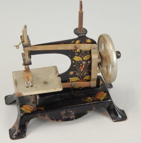 A German tin plate child's sewing machine