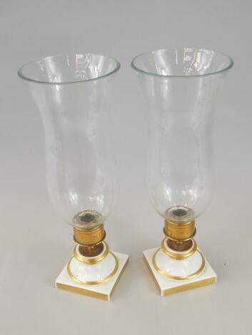 A pair of modern Portuguese porcelain glass and brass storm lanterns