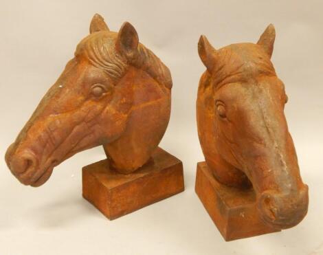 A pair of cast iron horse busts