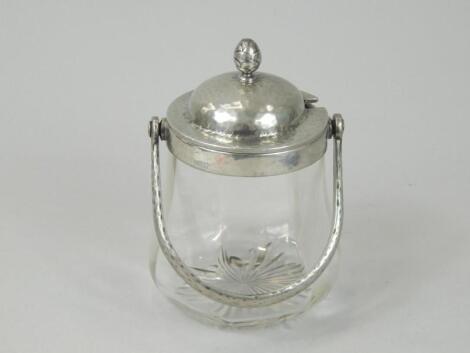 An early 20thC glass and pewter Arts & Crafts preserve jar and cover