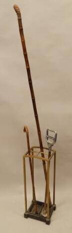 An Edwardian four division brass umbrella stand