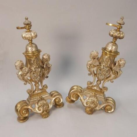 A pair of Continental silvered and gilt metal Andirons