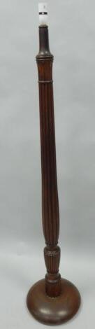 A mahogany standard lamp